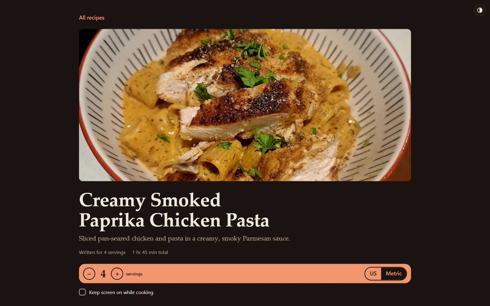 A recipe page: a photo of the dish, the title and description, and a bar with servings and US/metric controls