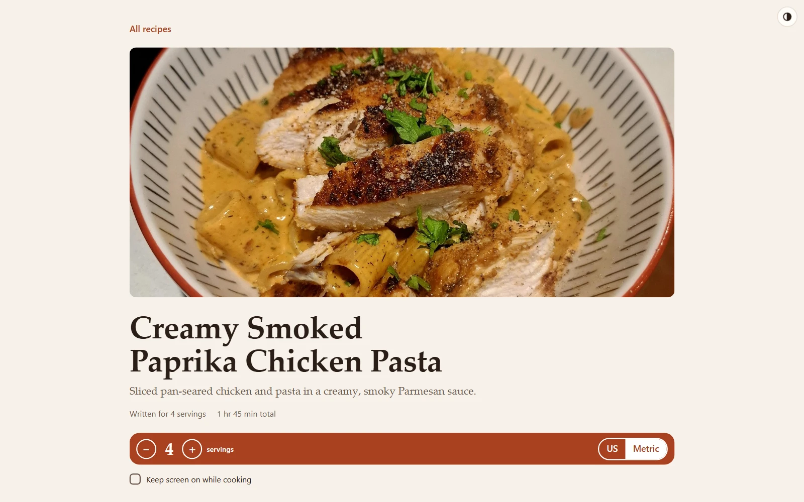 A recipe page: a photo of the dish, the title and description, and a bar with servings and US/metric controls